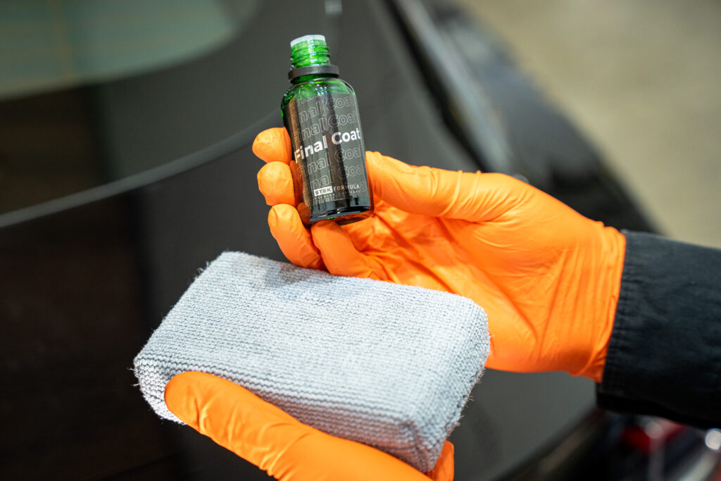 STek USA Final Coat Ceramic Coating being applied on clear bra paint protection film PPF on a Tesla Model Y at Alpine PPF in Denver, Colorado