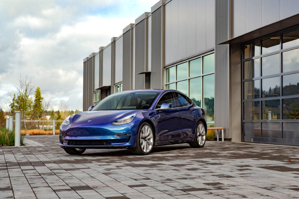 Tesla Model 3 wrapped in color shift blue paint protection film at Alpine PPF